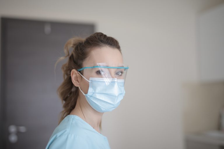 Nurse with surgical mask.